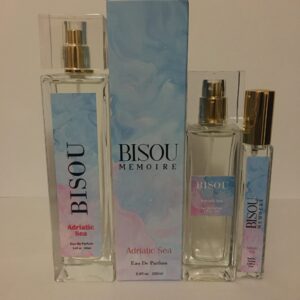 A group of three different bottles of perfume.