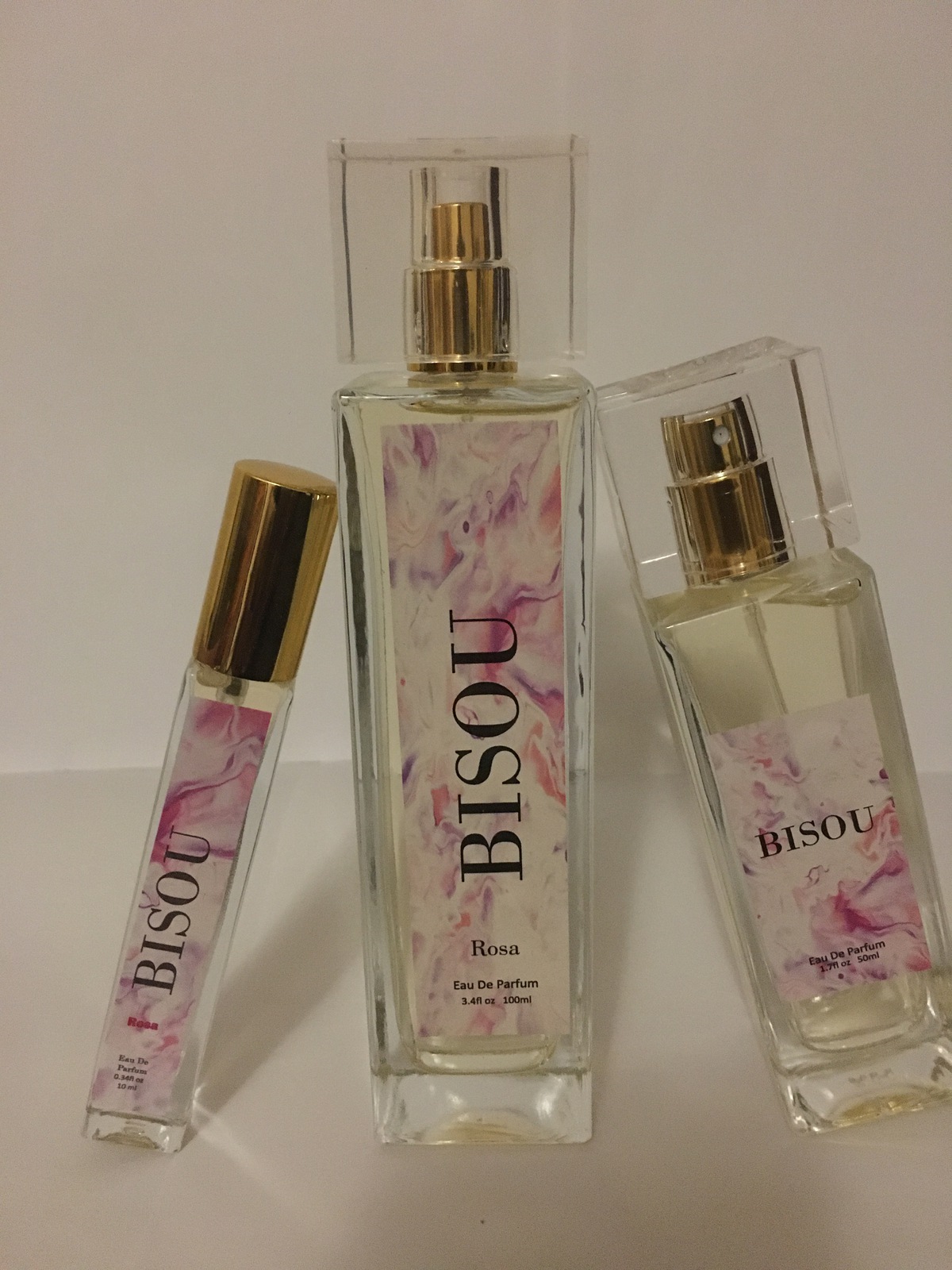 A set of three bottles with different scents.